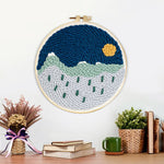 Finished tranquil mountain scenery artwork displayed on a wall