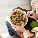 Creating handmade tree of life with colorful butterflies punch needle artwork