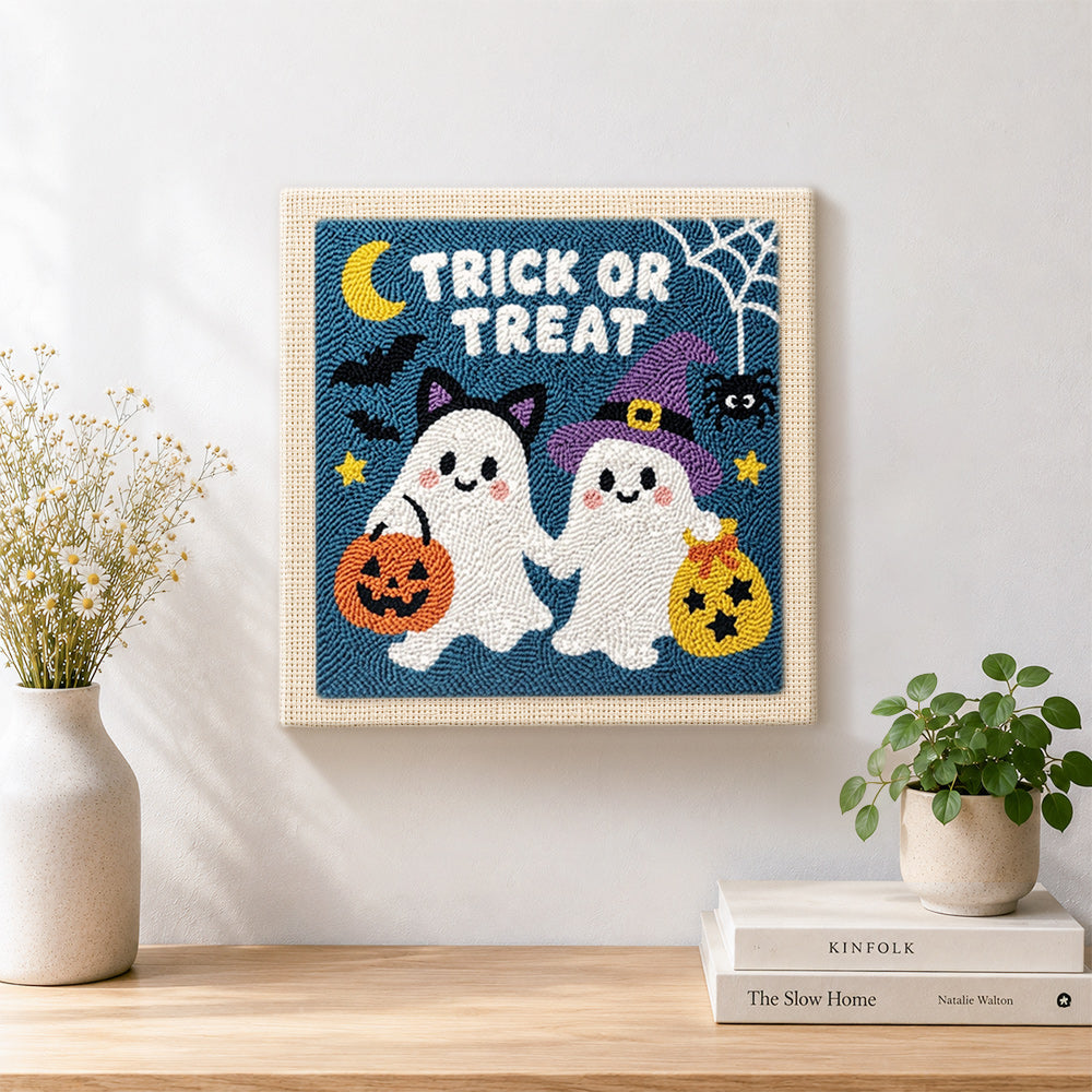 Finished trick or treat ghost friends artwork displayed on a wall