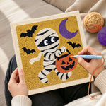 Creating handmade trick or treat mummy punch needle artwork