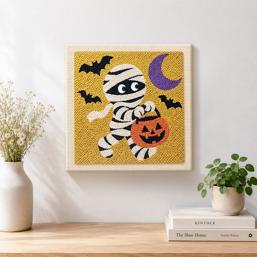 Finished trick or treat mummy artwork displayed on a wall