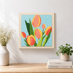 Finished tricolor tulips artwork displayed on a wall