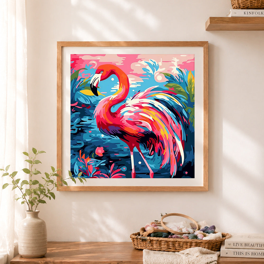 Finished tropical flamingo cross stitch artwork displayed as home decor