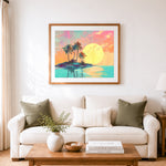 Finished tropical island sunset cross stitch artwork displayed as home decor