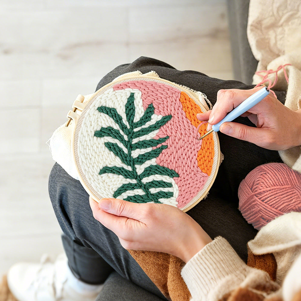 Creating handmade tropical leaf and sunset tones punch needle artwork