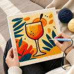 Creating handmade tropical orange cocktail punch needle artwork