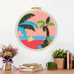 Finished tropical palm tree sunset artwork displayed on a wall