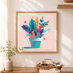 Finished tropical potted foliage cross stitch artwork displayed as home decor