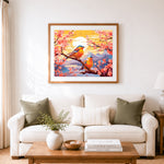 Finished twin birds on cherry branches cross stitch artwork displayed as home decor