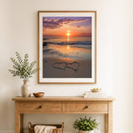 Finished twin hearts on sand cross stitch artwork displayed as home decor