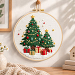 Twinkling christmas trees embroidery hoop wall art displayed as warm and cozy handmade home decor