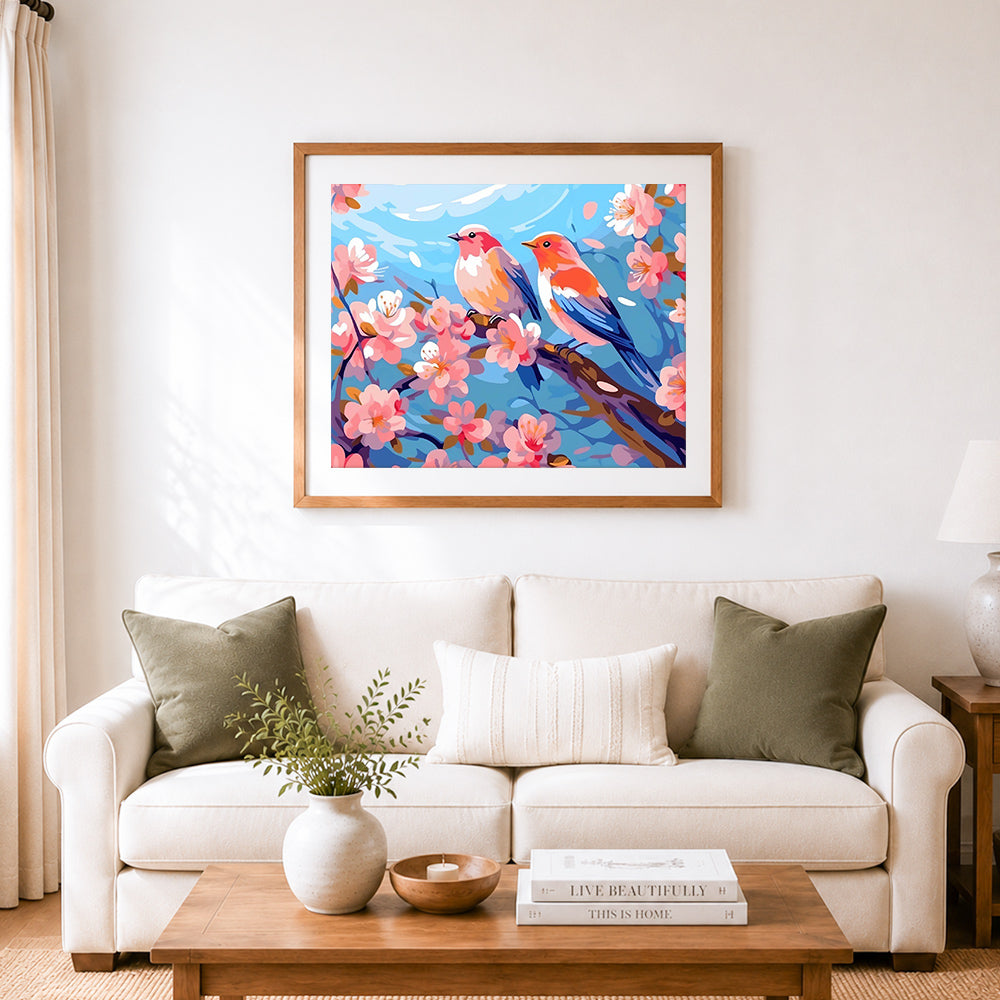 Finished two birds on cherry branches cross stitch artwork displayed as home decor