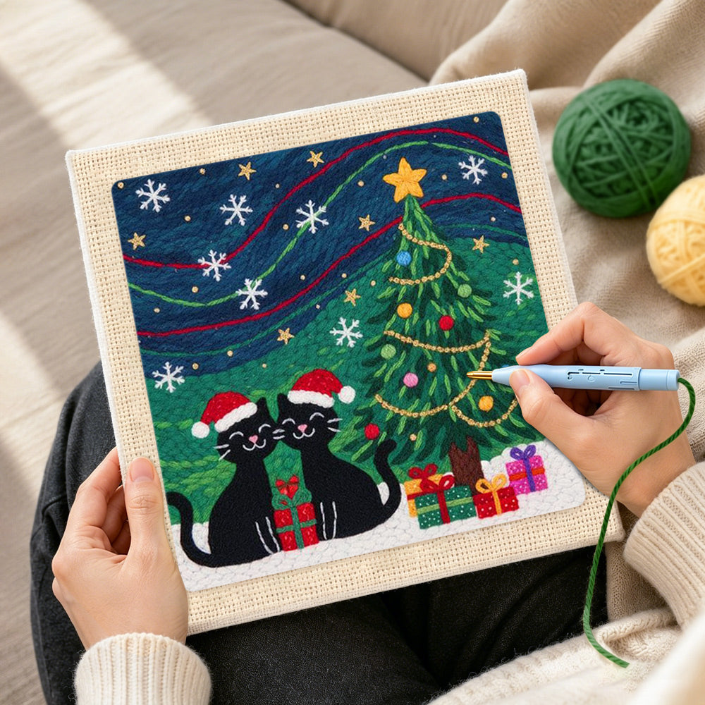 Creating handmade two black cats under christmas tree punch needle artwork