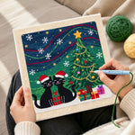 Creating handmade two black cats under christmas tree punch needle artwork