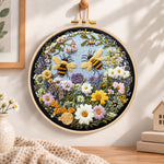 Two bumblebees in flower garden embroidery hoop wall art displayed as warm and cozy handmade home decor