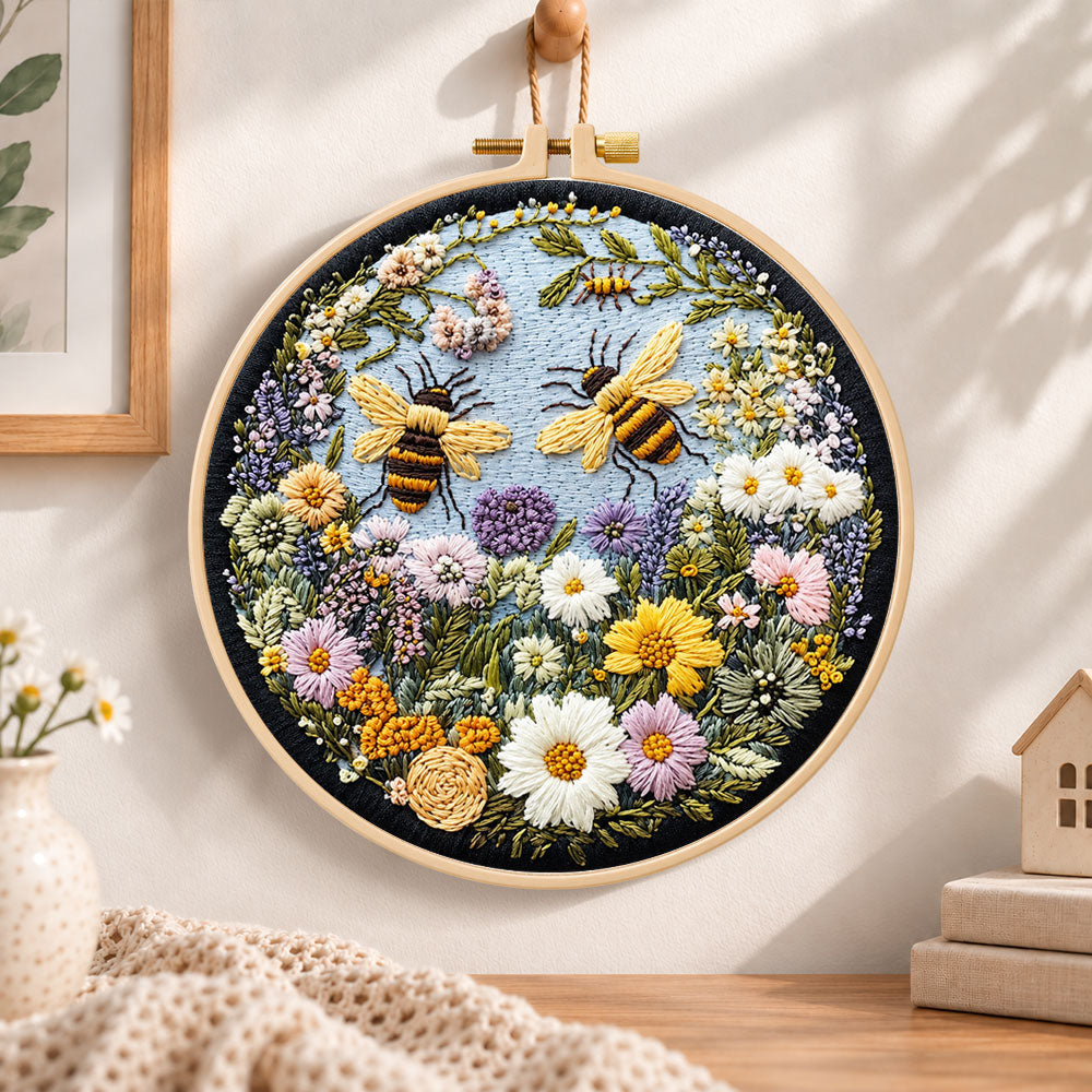 Two bumblebees in flower garden embroidery hoop wall art displayed as warm and cozy handmade home decor