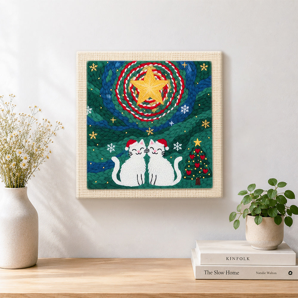 Finished two cats in santa hats artwork displayed on a wall