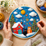 Creating the two christmas cats with red house wool painting by hand with a felting needle