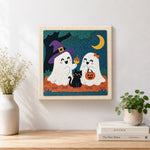 Finished two cute trick or treat ghosts artwork displayed on a wall