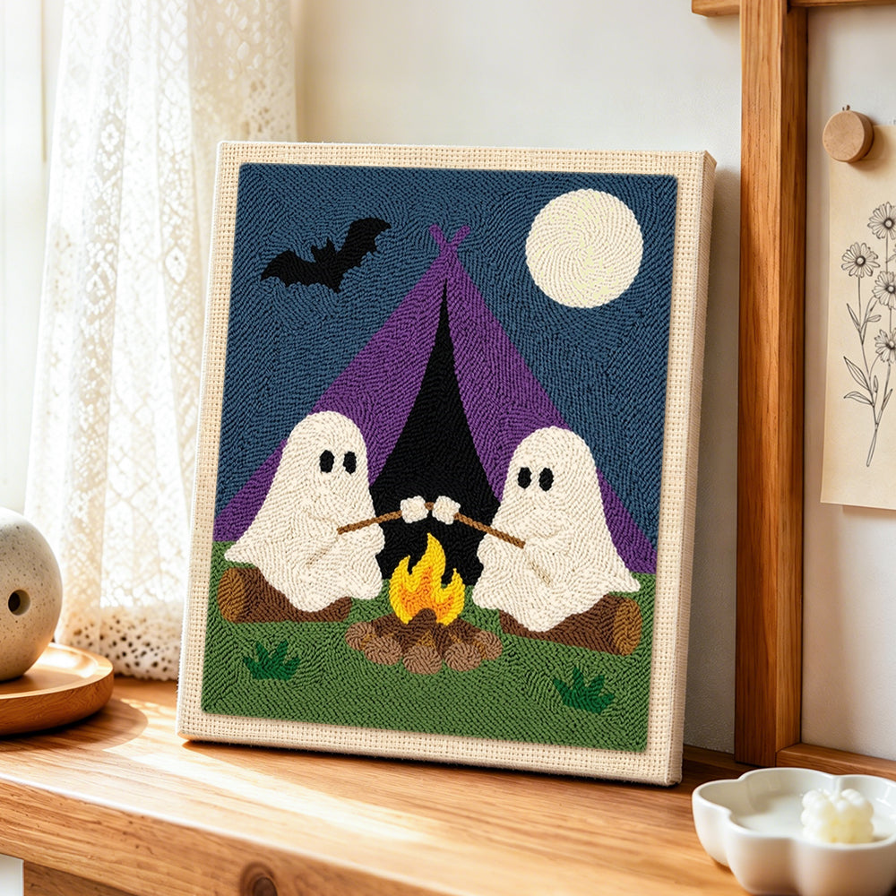Two ghosts camping punch needle artwork displayed on a table