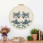 Finished two little gray foxes artwork displayed on a wall