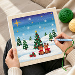 Creating handmade two reindeers in snow punch needle artwork