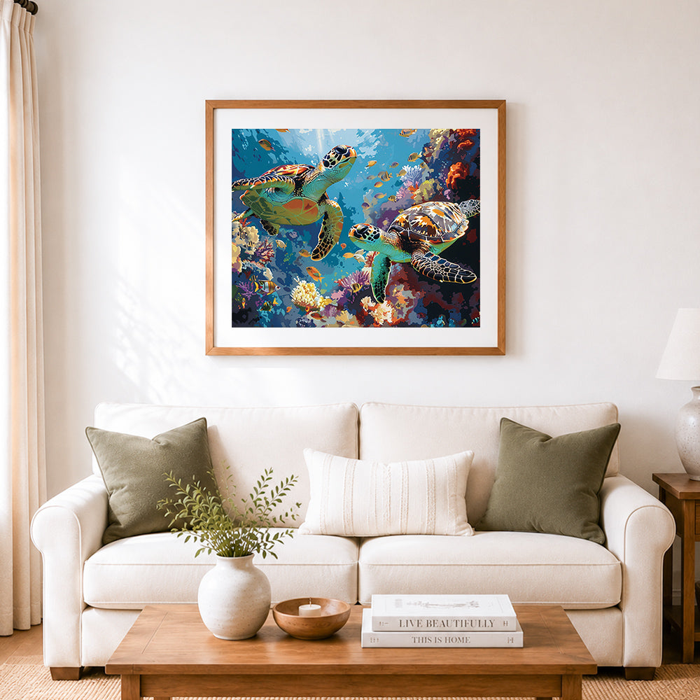 Finished two sea turtles in vibrant coral reef cross stitch artwork displayed as home decor