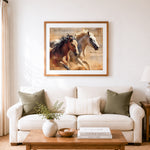 Finished two stallions running wild cross stitch artwork displayed as home decor
