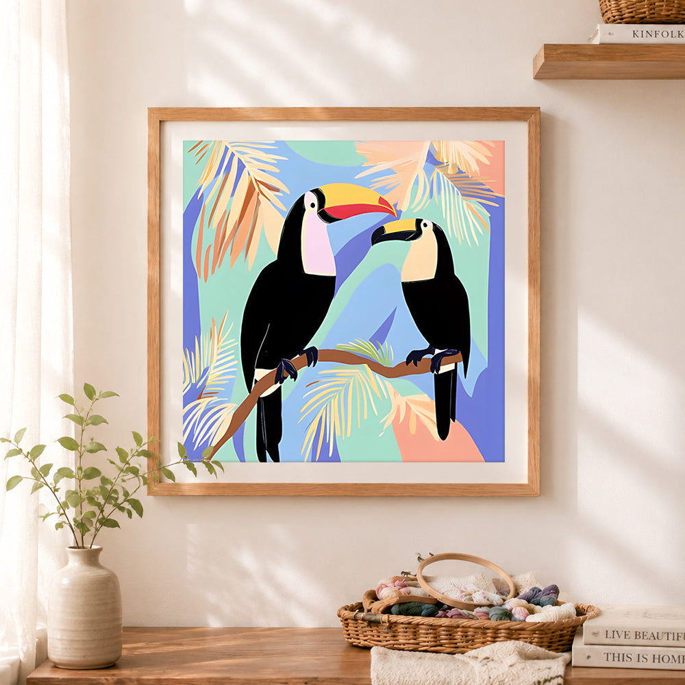 Finished two toucans on tropical branch cross stitch artwork displayed as home decor