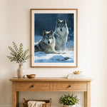 Finished two wolves in winter snow cross stitch artwork displayed as home decor