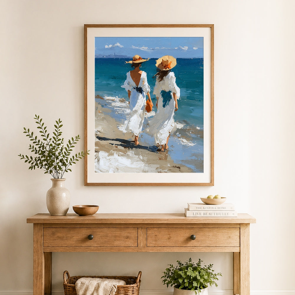 Finished two women in white dresses walking on beach cross stitch artwork displayed as home decor