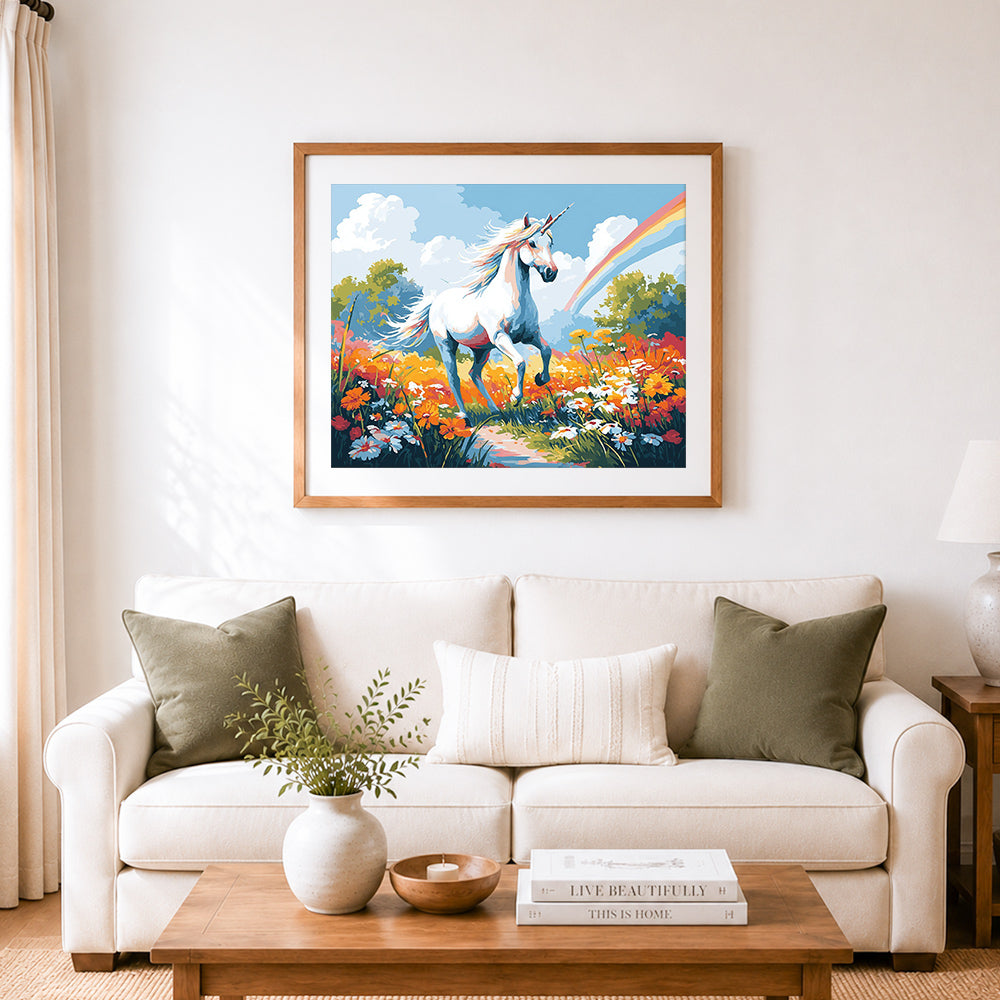 Finished unicorn in wild flower field cross stitch artwork displayed as home decor
