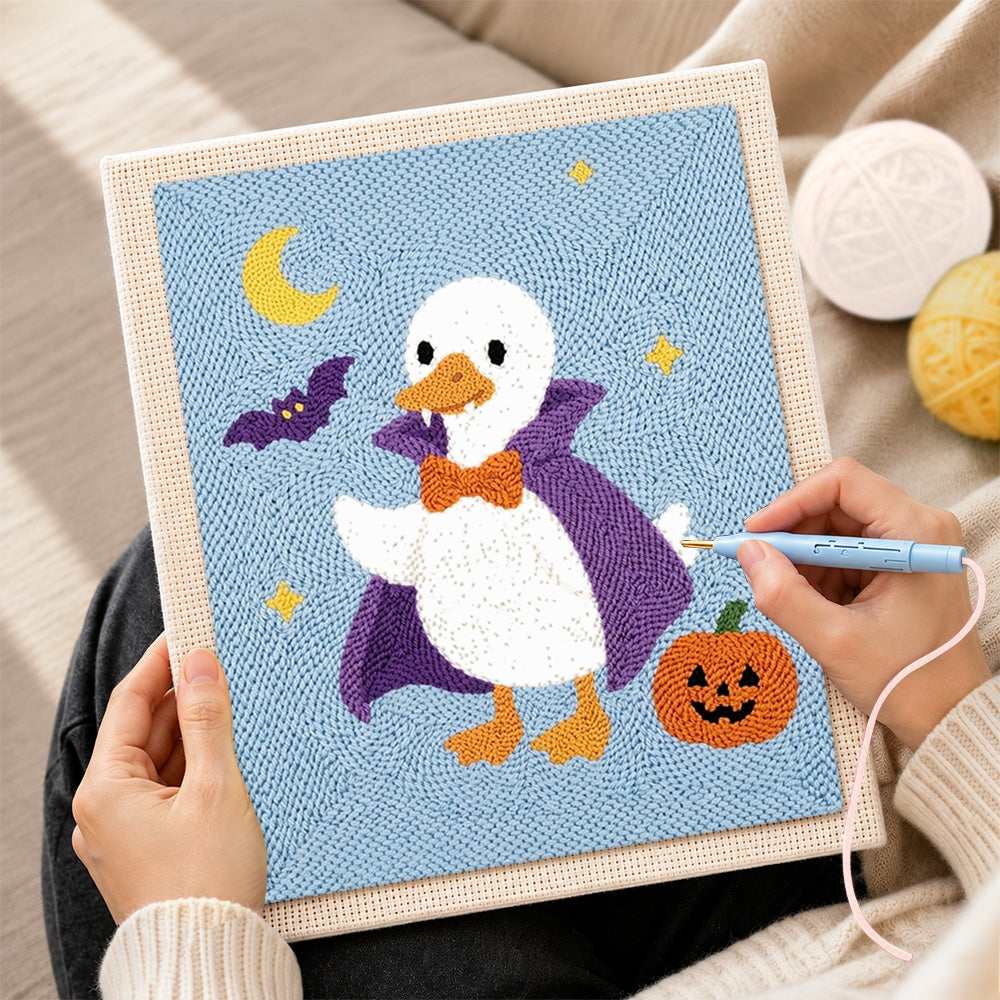 Creating handmade vampire duck halloween style punch needle artwork