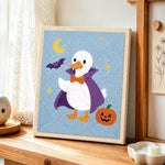 Vampire duck halloween style punch needle artwork displayed on a table