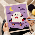 Creating handmade vampire ghost on skateboard punch needle artwork