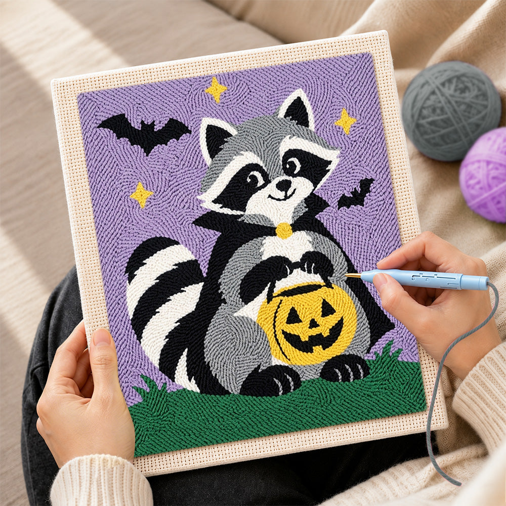 Creating handmade vampire raccoon with pumpkin bucket punch needle artwork