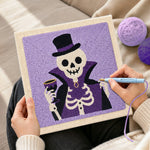 Creating handmade vampire skeleton punch needle artwork