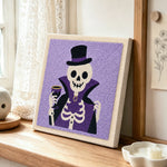 Vampire skeleton punch needle artwork displayed on a table