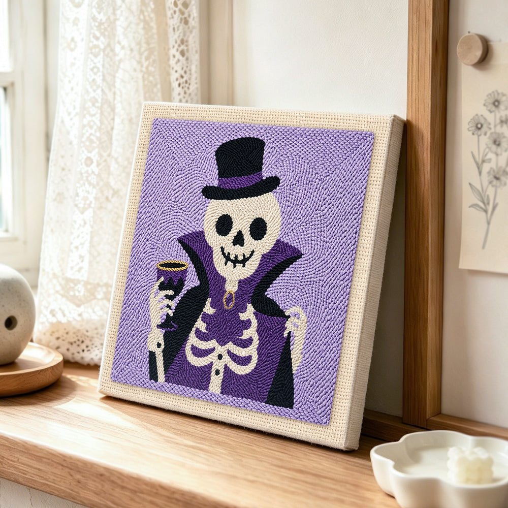Vampire skeleton punch needle artwork displayed on a table
