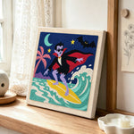 Vampire surfing punch needle artwork displayed on a table