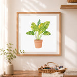Finished variegated tropical houseplant cross stitch artwork displayed as home decor