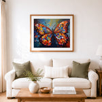 Finished vibrant abstract butterfly with floral wings cross stitch artwork displayed as home decor