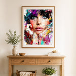Finished vibrant abstract portrait cross stitch artwork displayed as home decor