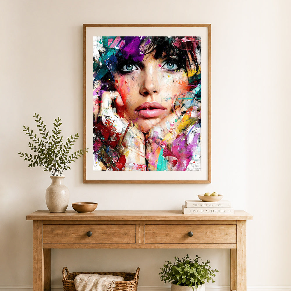 Finished vibrant abstract portrait cross stitch artwork displayed as home decor
