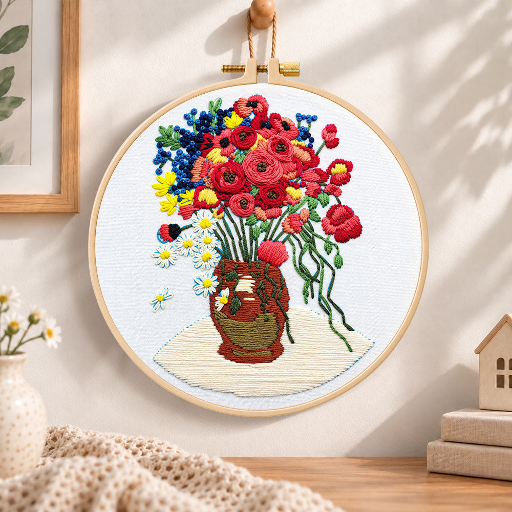 Vibrant bouquet in vase embroidery hoop wall art displayed as warm and cozy handmade home decor
