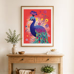 Finished vibrant garden peacock cross stitch artwork displayed as home decor