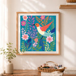 Finished vibrant hummingbird garden cross stitch artwork displayed as home decor