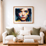 Finished vibrant impasto female face cross stitch artwork displayed as home decor