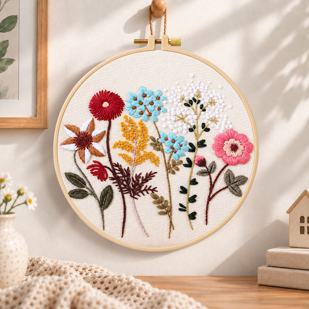 Vibrant mixed blooms embroidery hoop wall art displayed as warm and cozy handmade home decor