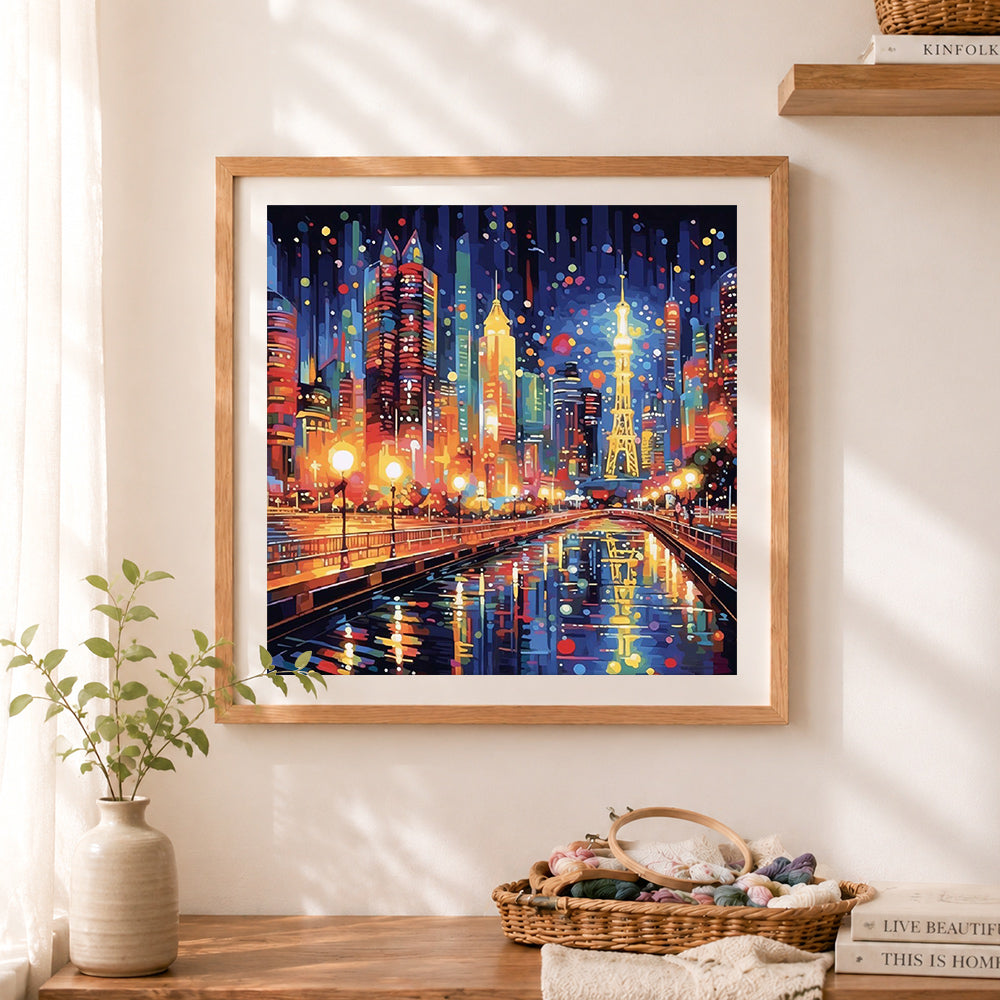 Finished vibrant night metropolis cross stitch artwork displayed as home decor